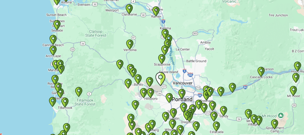Map featuring green location markers clustered around Portland, Oregon and surrounding areas—including Seaside, Tillamook, Hillsboro, and Vancouver—making it easy to find top-rated roofing companies and residential roofers near you.