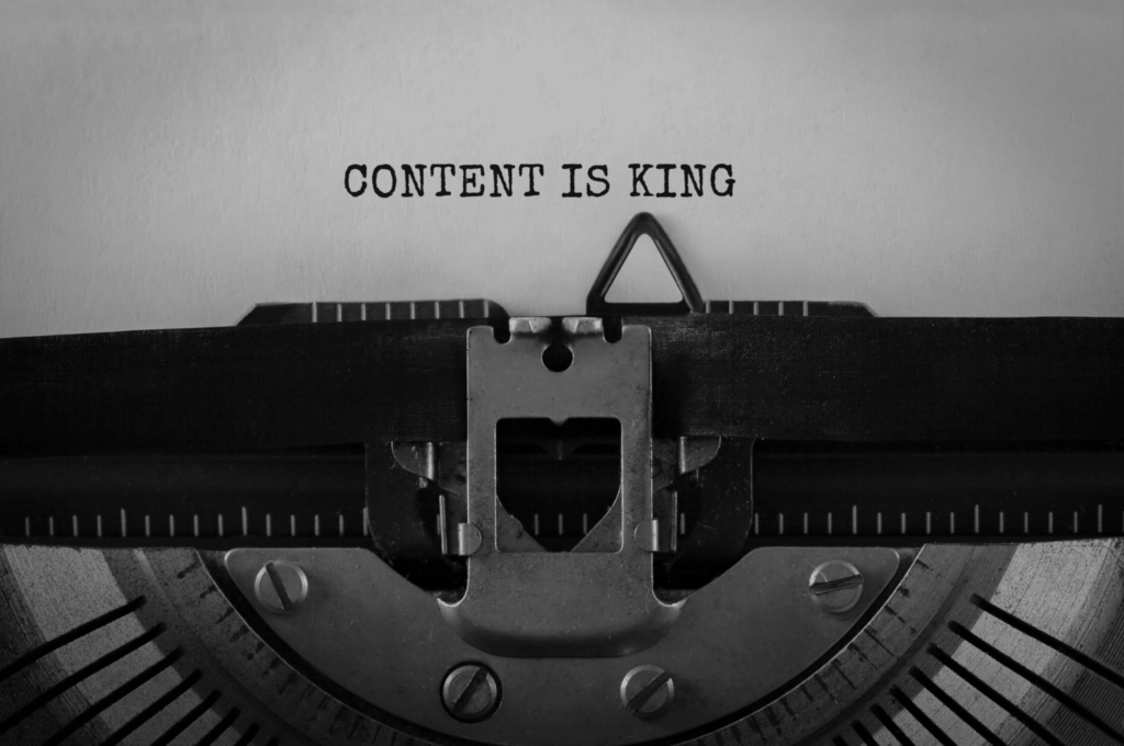 An image showcasing the process of content marketing services with a team brainstorming ideas and creating content.