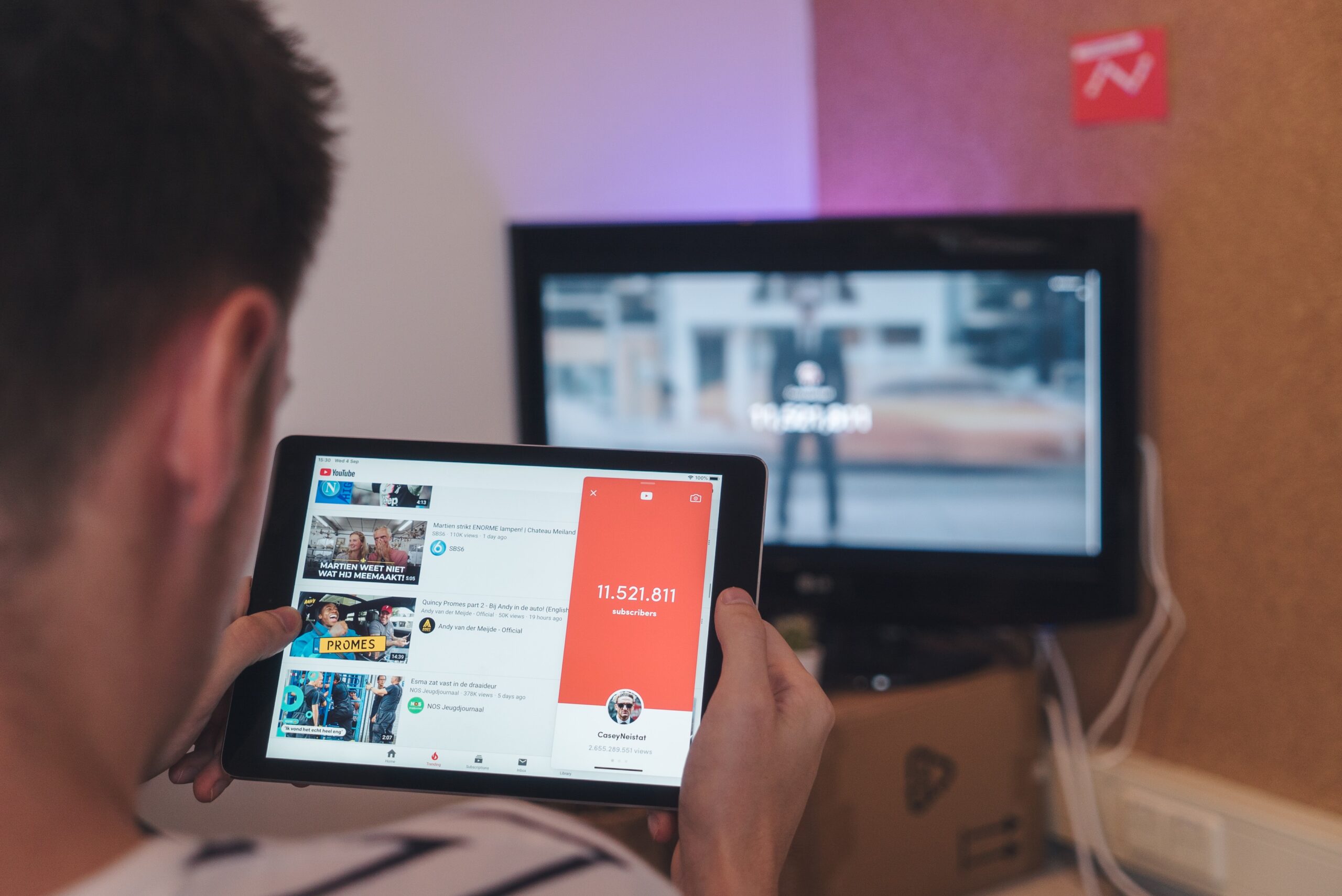 man watching number of Youtube subscribers.jpg