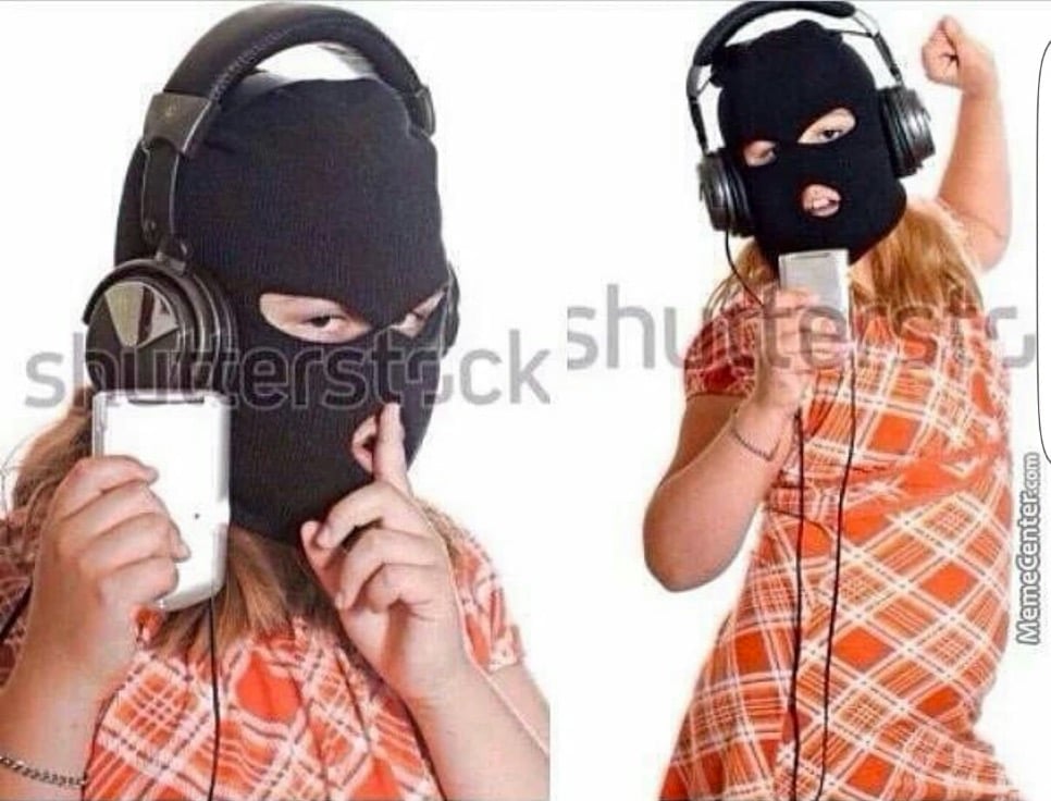 Girl with robbers mask on and pirated music, strange stock photos