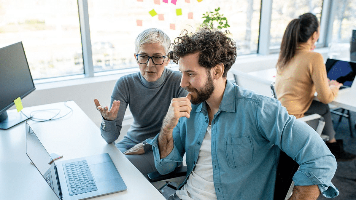 A group of people discussing digital marketing strategies in a meeting