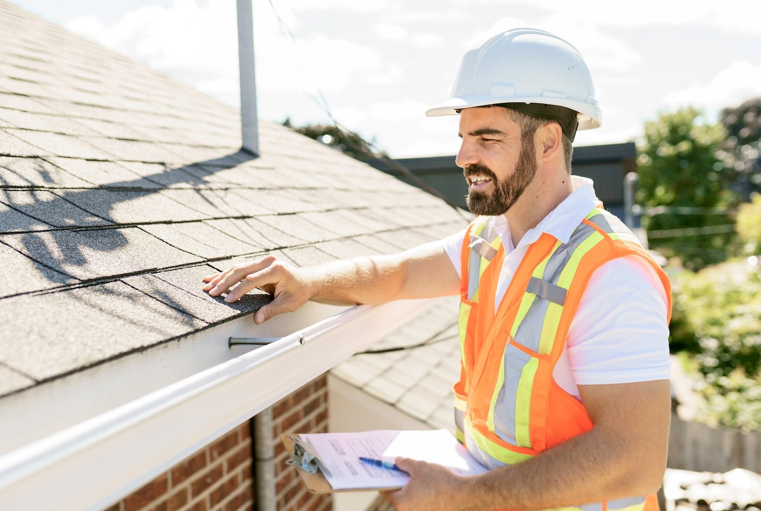 man performing roof inspection