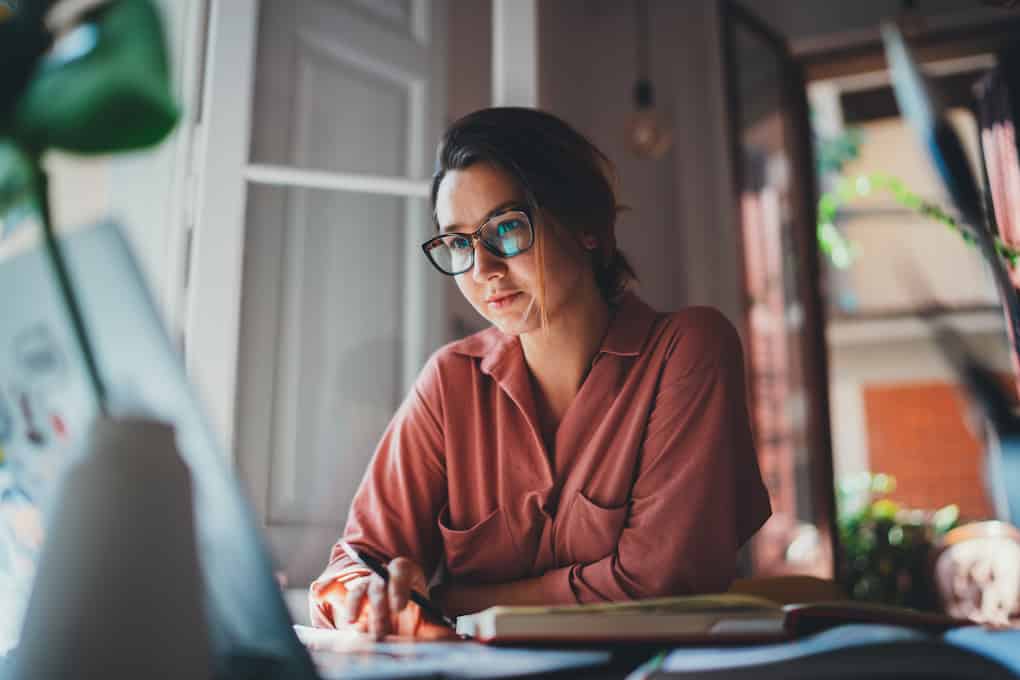woman designing a high-converting landing page