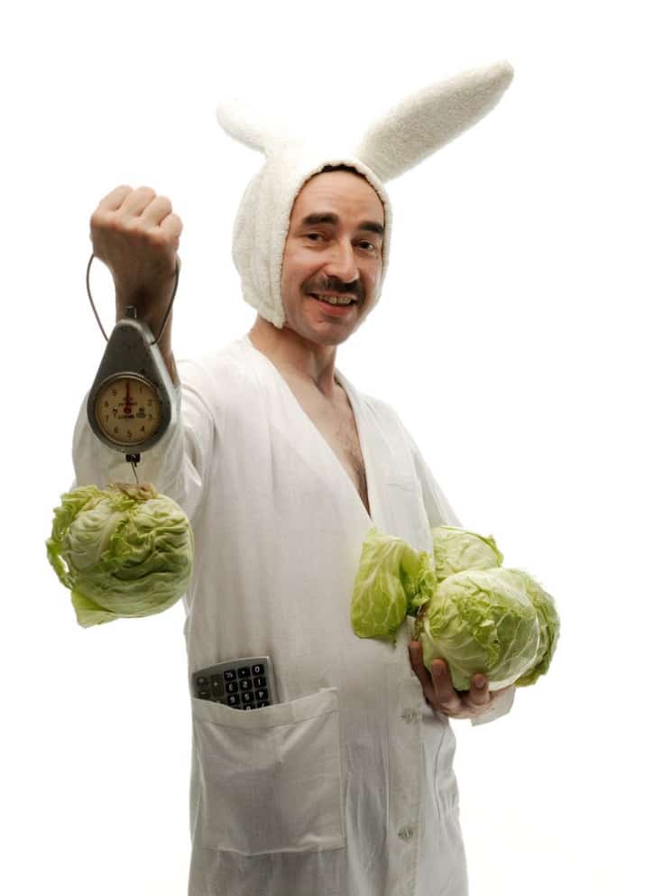 Man weighing lettuce stock photo