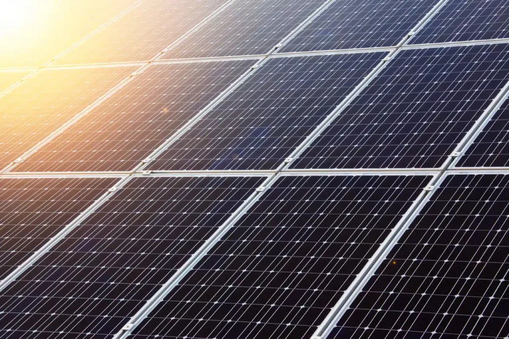 Close-up view of solar panels installed on a residential roof, showcasing the clean, renewable energy solution that solar companies provide. A solar marketing agency specializes in driving leads and customer engagement for these businesses through effective website design, SEO, and targeted lead generation strategies, helping solar companies grow their customer base and increase sales.