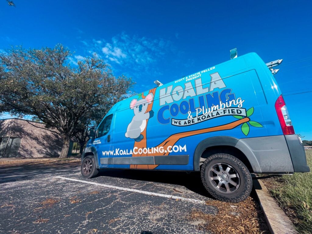 Blue Koala Cooling & Plumbing van with branding parked outside; visit their site via Hook Agency for HVAC pricing details.