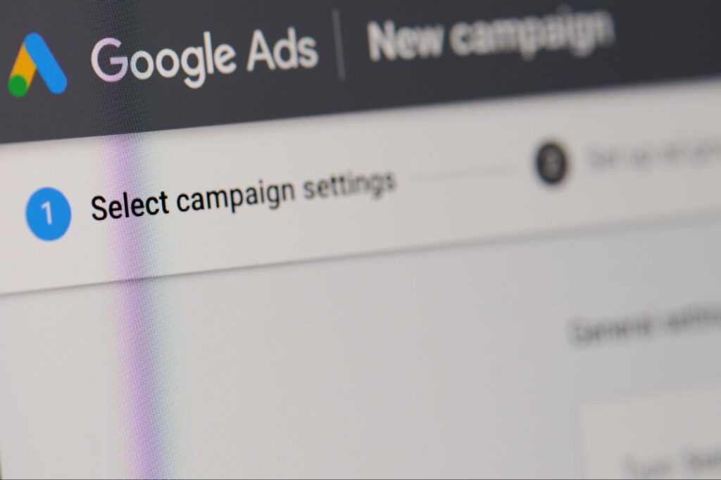 Google Ads interface displaying "Select campaign settings" in "New campaign"—visual for Hook Agency’s Pause Marketing guidance.