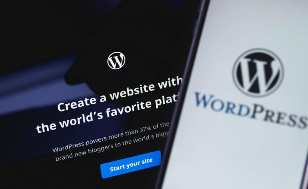 Monitor and smartphone display the WordPress logo and message on building sites for contractors to generate more online leads.