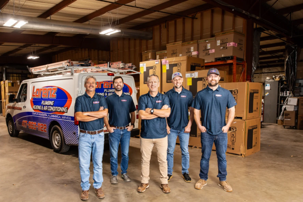 Five Loreniz team members stand in front of their branded van, prepared to grow their home service business.