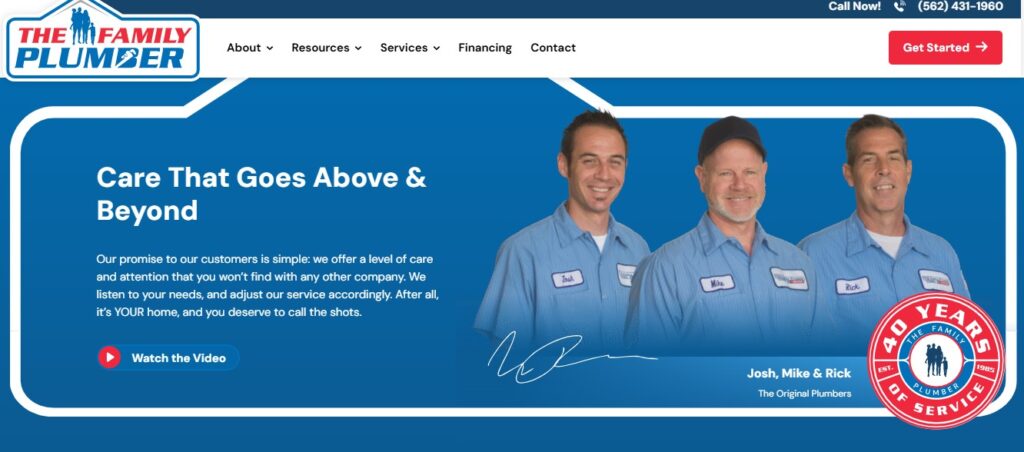 Three plumbers in blue uniforms pose by a badge marking 40 years of The Family Plumber. Watch the video—Hook Agency.