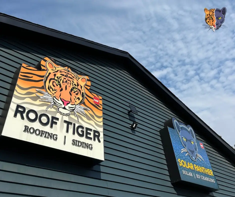 Two bold, animal-themed business signs—Roof Tiger and Solar Panther—demonstrate strong branding on a building exterior.