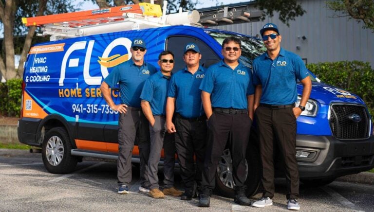 Five FLO Home Services staff stand by their branded van outdoors. Contact us to request your free website audit from Hook Agency.